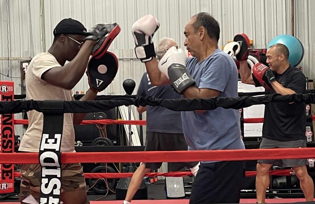 Group sparring in the ring.